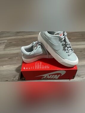 Nike Women's Light Gray Sneakers with White Sole and Small Red Swoosh